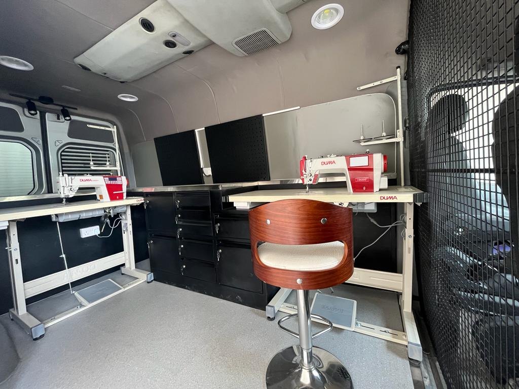 Inside the van: sewing machines and fitting area